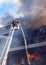 Firefighters on stairs extinguish a big fire