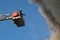 Firefighters on the stairs extinguish a fire on the roof of a residential high-rise building. top view