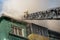 Firefighters on the stairs extinguish a fire on the roof of a residential high-rise building. top view