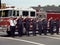 Firefighters stand at attention