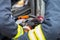 Firefighters using hydraulic tools during a rescue operation training. Rescuers unlock the passenger in car after