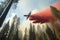 firefighting aircraft flies over forest, dropping fire retardant