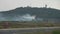 Firefighting aircraft flies over the forest and dumps water to extinguish a fire