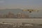 Firefighting aircraft flying over the sea on the beach