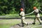 Firefighting team: firemen in protective ensembles watering forest