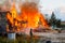 Fireman extinguishes a burning house