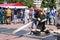 A fireman in a fireproof suit and a helmet holding a fire hose at a fire sport competition. Minsk, Belarus, 08.07.2018