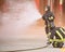 Fireman with a mask extinguishes a fire