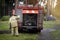 Fireman near a fire truck in the forest. Extinguishing forest fires in Russia