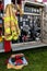 Fireman safety gear on readiness with a fire red truck at a event.