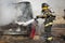 Fireman training on a burning car