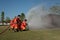 fireman watering against fire