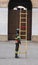 Fireman with wooden ladder