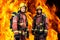 Firemen against burning background.