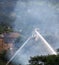 Firemen on an elevated platform putting out the fire at the former walkeys clogs mill in hebden bridge