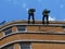 Firemen going down a rope from the roof - demonstration exercise