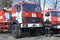 Firemen standing near fire trucks before training