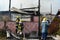 Firemen and volunteers working extinguishing fire on a subdivision house