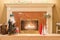 Fireplace with burning fire surrounded by Christmas decorations