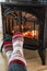 Fireplace cozy winter woman warming up feet