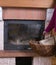 Fireplace and fire wood in a wattled basket