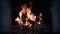 Fireplace firewood burning flame fire light blaze at rustic furnace brickwork closeup slow motion