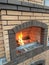 Fireplace made of bricks beautiful view of a burning fire