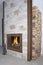 Fireplace with raw iron I profiles and wood