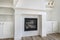 Fireplace with white tiles in herringbone pattern surround