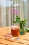 Fireweed herbal tea in the glass cup on wooden table