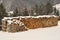 Firewood covered with snow