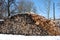 Firewood pile next to boiler house.