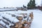 Firewood in the snow by the road