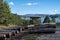 Firewood storage in Pindus mountain forest background. View of Aoos Springs Lake in Epirus, Greece