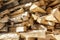 Firewood in woodpile. Wooden background.