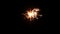 Firework sparkler burning at night, slow motion