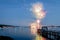 Fireworks on Boothbay Harbor, Maine, reflect off the water on July 4th