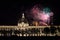 Fireworks bursting over Hotel Dieu in Lyon for French National Holiday, Bastille day, while Basilique de Fourviere Basilica church