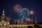 Fireworks bursting over Hotel Dieu in Lyon for French National Holiday, Bastille day, while Basilique de Fourviere Basilica church