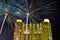 Fireworks celebration in downtown city center with tall apartment and office buildings