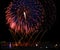 Fireworks,colorful fireworks background,fireworks explosion in dark sky with village silhoutte in Zurrieq,Malta, fireworks in Malt