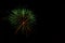 Fireworks display in night sky green left side