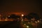 Fireworks exploding in the orange sky of Nieuwerkerk aan den IJssel, colored orange by assimilation growing lights of greenhouses.