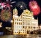 Fireworks at the illuminated town hall of Augsburg at night