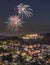 Fireworks in Koenigstein, Taunus, Germany. View over the city with the ruins of the castle in the sunset