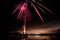 Fireworks over lake in beautiful landscape