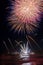 Fireworks reflecting in the water from Forte dei Marmi\'s Pier