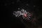 Fireworks. Salute. Sky background A trio of bright red, green and blue sparkling lights in the night sky during the New Year and