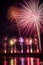 The fireworks on stoned bridge on the Orb River with reflection in Beziers in France