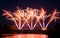 fireworks on stoned bridge on the Orb River with reflection in Beziers in France